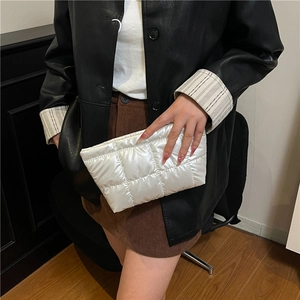 Chic white quilted clutch bag with glossy finish and square stitch for autumn winter