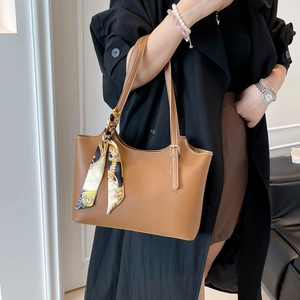 Brown leather tote bag with elegant silk scarf detail and double long shoulder straps