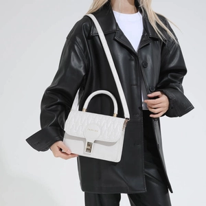 Chic white quilted leather handbag with gold metal lock and fashion detail for women