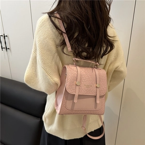Pink crocodile pattern PU leather backpack for women with gold hardware accents