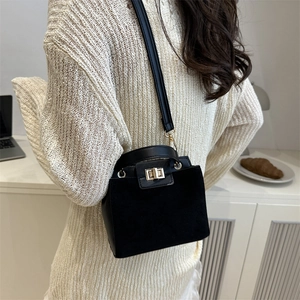 Retro black matte leather handbag with gold metal twist lock and versatile shoulder strap
