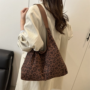 Large leopard print tote bag with brown faux leather strap for autumn fashion