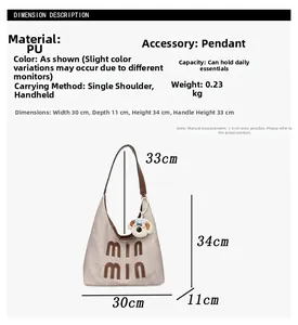 Detailed view of the large capacity PU tote bag with dimensions and dog charm detail