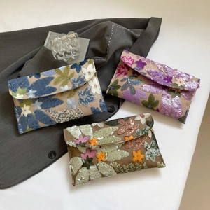 Floral sequin embroidery envelope clutches in navy, pink and bronze tones