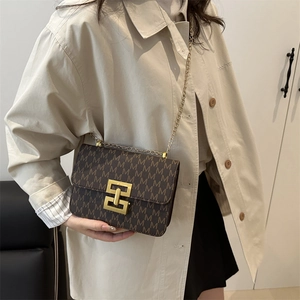 Retro brown crossbody square bag with M-letter monogram and gold metal buckle