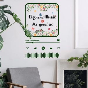 Detail of floral butterfly music wall decal with keep a good mood quote on white wall