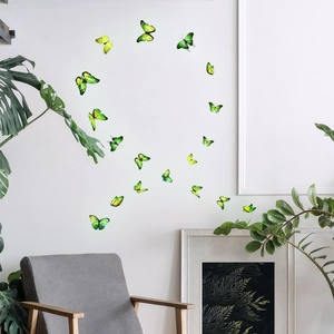 Detail of green 3D butterfly wall stickers with realistic wings on a modern white wall