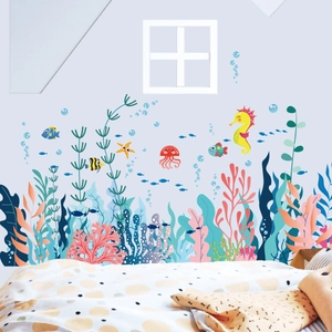 Detailed view of colorful ocean sea life wall decals applied to a child's bedroom wall