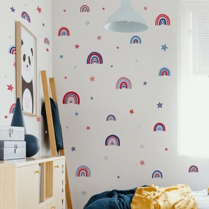 Rainbow and stars wall stickers in a cozy nursery room with wooden furniture