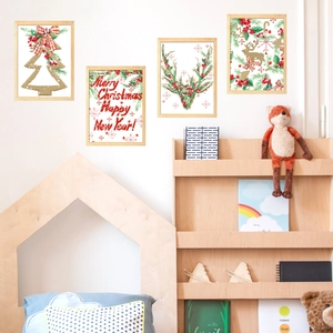 Detailed view of 4-piece watercolor Christmas wall stickers in a cozy nursery setting