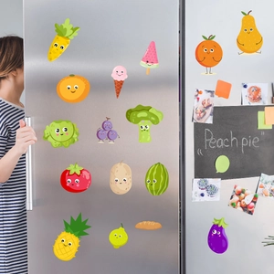 Cute cartoon fruit and vegetable self-adhesive stickers on a silver kitchen refrigerator