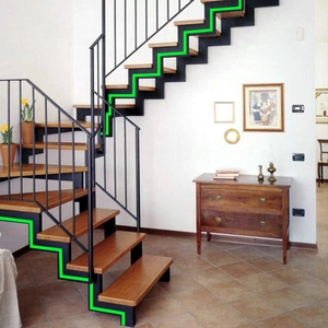Glow in the dark tape for safety warning on indoor wooden stairs with metal frame
