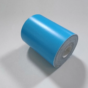 Close-up of a luminous blue glow-in-the-dark warning tape roll for stair safety
