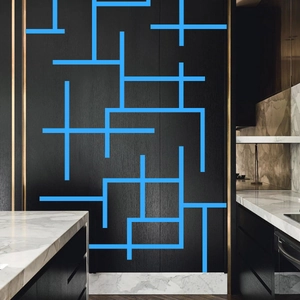 Luminous blue anti-slip tape for stairs glowing brightly on dark wood modern kitchen cabinets