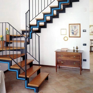 Blue luminous non-slip glow tape installed on modern wooden stairs for safety