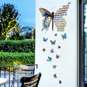 3D butterfly wall stickers with inspirational text on a white outdoor balcony wall