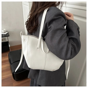 Side view of a white lychee grain tote bag showing large capacity and drawstring details