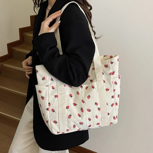 Versatile white corduroy strawberry print tote bag with large capacity for commuting