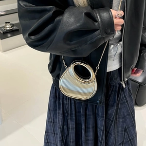 Silver metallic mini semi-circle clutch bag with vertical stripes and chain strap