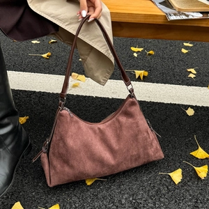 Retro large capacity mocha suede shoulder bag on autumn street with ginkgo leaves