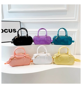 Macro shot of jelly PVC mini handbags in various macaron colors with polished gloss