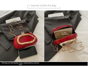 Detail of red patent leather mini bag with gold C-handle and chain strap for essentials