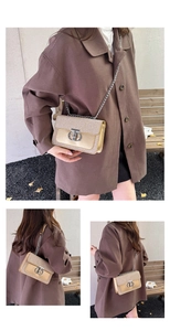 Champagne gold crossbody bag with glossy flap, silver chain and metal lock detail
