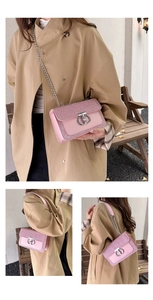 Detailed view of pink sequin shoulder bag with silver chain strap and metal ring buckle