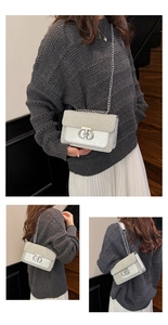 Detail of silver metallic flap bag with glitter panel, chain strap and circular metal lock