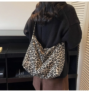 Close-up of leopard print canvas bag showing soft texture and spacious slouchy design
