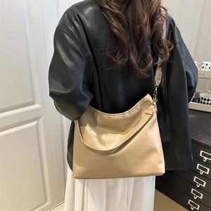 Minimalist beige hobo bag with large capacity and vintage patterned woven shoulder strap