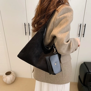 Minimalist black matte suede hobo tote bag for commuting with small matching pouch