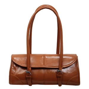 Vintage caramel oversized underarm bag in glossy leather for autumn winter fashion