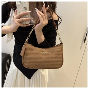 Detail of brown woven shoulder bag with gold chain strap and Fashion & Bags text