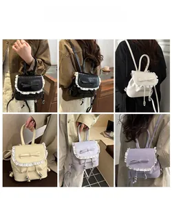 Detail view of lace-trimmed ballet-style backpacks in four colors with bow details