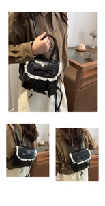 Detailed views of mini black ballet-style bucket bag with white lace and bow details