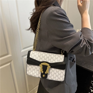 Chic black and white checkerboard shoulder bag with golden chain strap and letter patterns