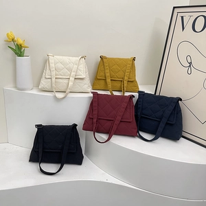Quilted diamond stitch crossbody bags in five colors with adjustable fabric straps