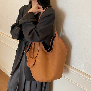 Large brown faux suede tote bag with shoulder strap and matching pouch for women