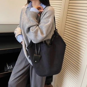 Large black faux suede tote bag for women with minimalist shoulder strap design