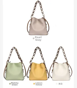 Litchi pattern leather bucket bags in four colors with thick chain handles and drawstrings