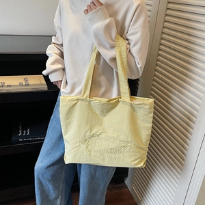 Minimalist large capacity light yellow canvas tote bag with embroidery details