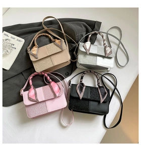 Detail of square handbags with sequin patchwork and scarf-wrapped handles in four colors
