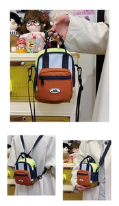 Detail of colorful water-resistant nylon crossbody bag with adjustable blue strap