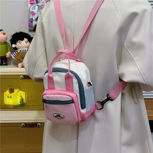 Mini pink and white color-block nylon backpack with adjustable straps for women