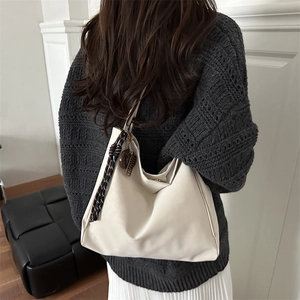 Large cream hobo tote bag in soft faux leather with decorative woven charms for women
