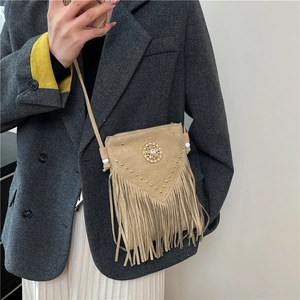 Retro khaki saddle bag with fringe tassels and gold studs for bohemian fashion