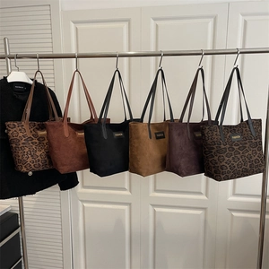 Large vintage tote bags in leopard and matte finishes with FASHION logo tag