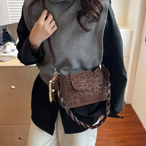 Retro contrast leopard print shoulder bag with woven handle and beaded charm detail