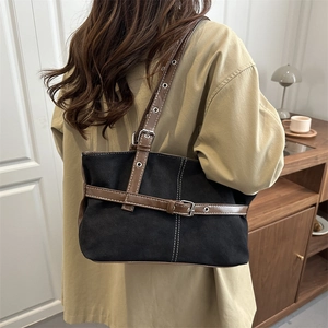 Retro black suede tote bag with brown leather straps and vintage metal eyelets